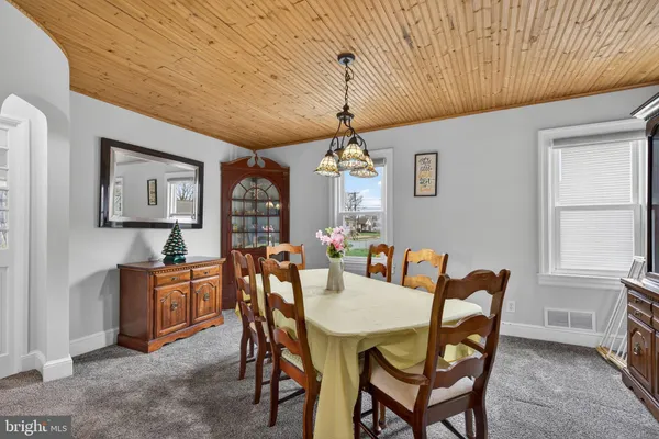 a view of a house with a snow in the road
