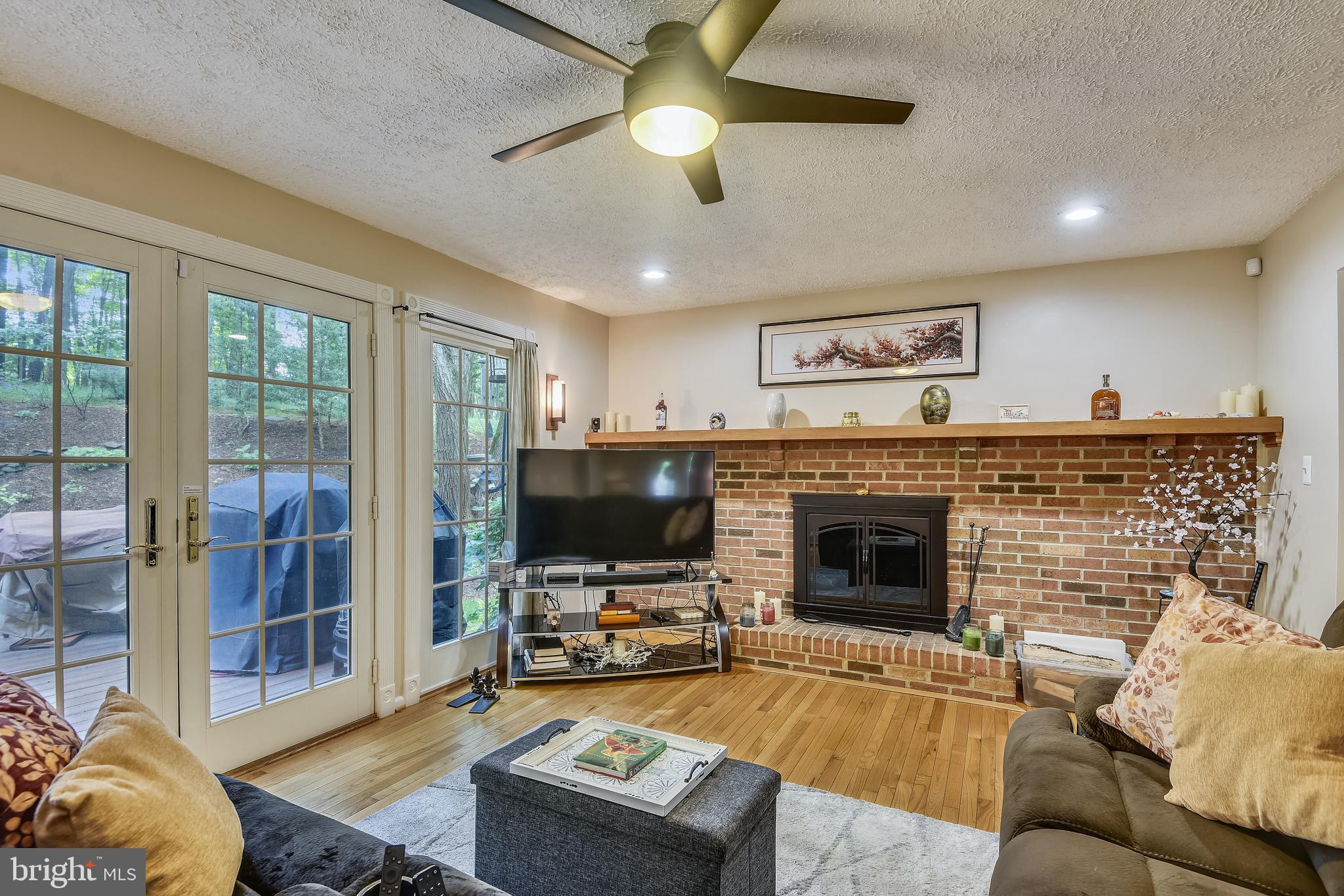 1515 Stuart Road Reston, VA 20194 - Photo 25 of 81 Fam Rm w/FP & French Doors to Patio & Waterfall