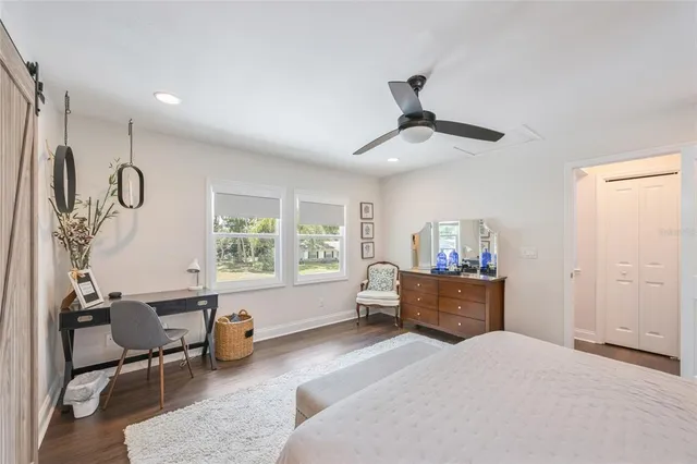 a bedroom with furniture and a window