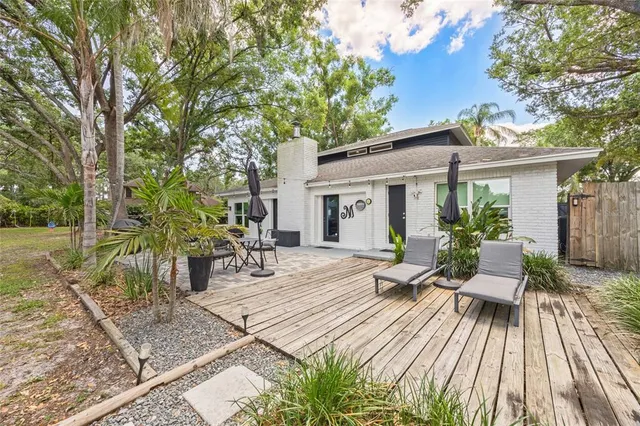 a view of backyard with trampoline