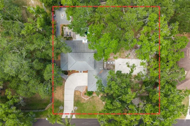 an aerial view of ocean residential house with outdoor space and trees around
