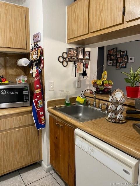 15619 Southwest 73rd Cir Terrace, Unit 106 Miami, FL 33193 - Photo 5 of 18 a view of a kitchen with appliances and cabinets