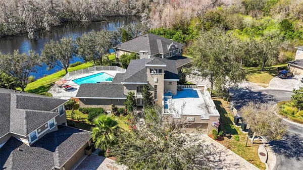 an aerial view of a house with a lake view