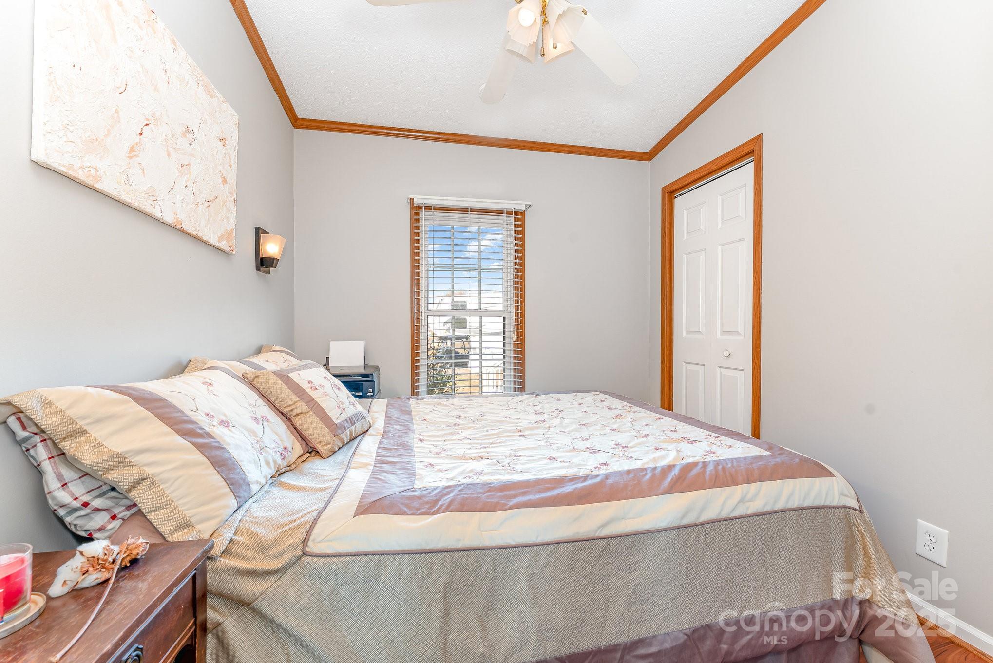 231 Badin Vw Road New London, NC 28127 - Photo 12 of 48 a bedroom with a bed and a window