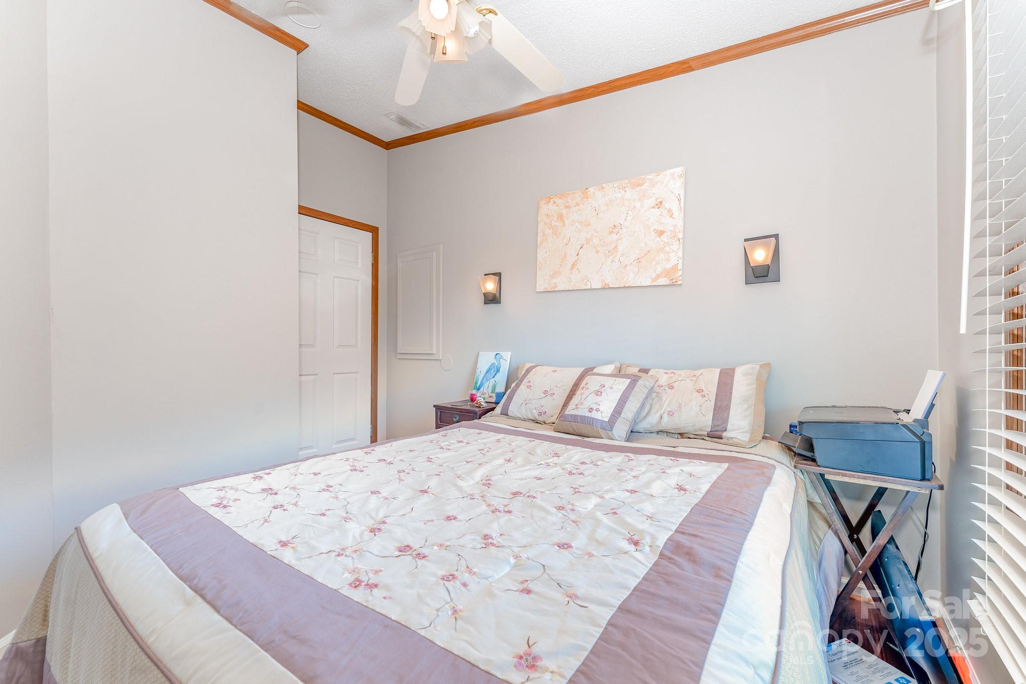 231 Badin Vw Road New London, NC 28127 - Photo 13 of 48 a bed sitting in a bedroom and a table