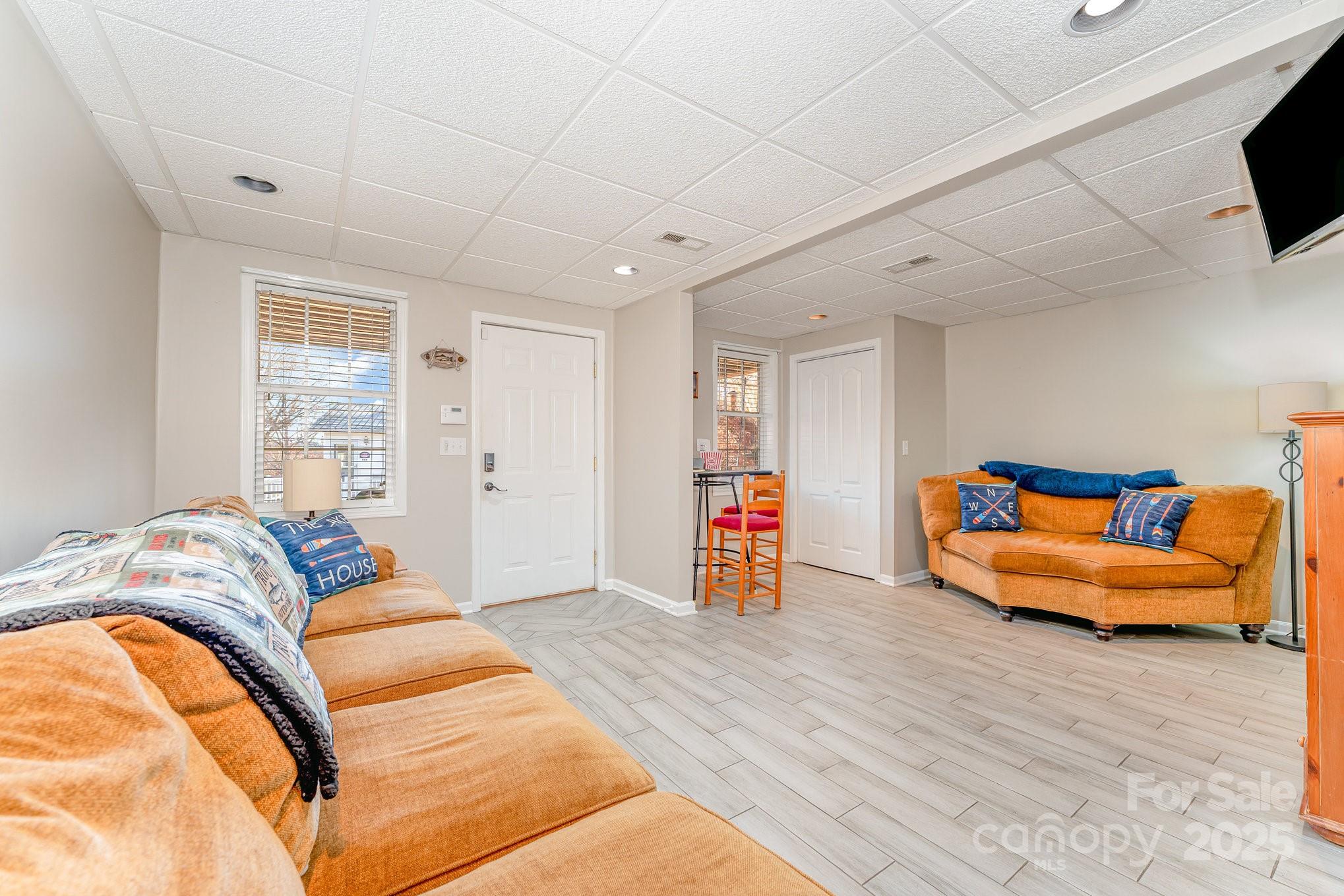 231 Badin Vw Road New London, NC 28127 - Photo 16 of 48 a living room with furniture and a flat screen tv