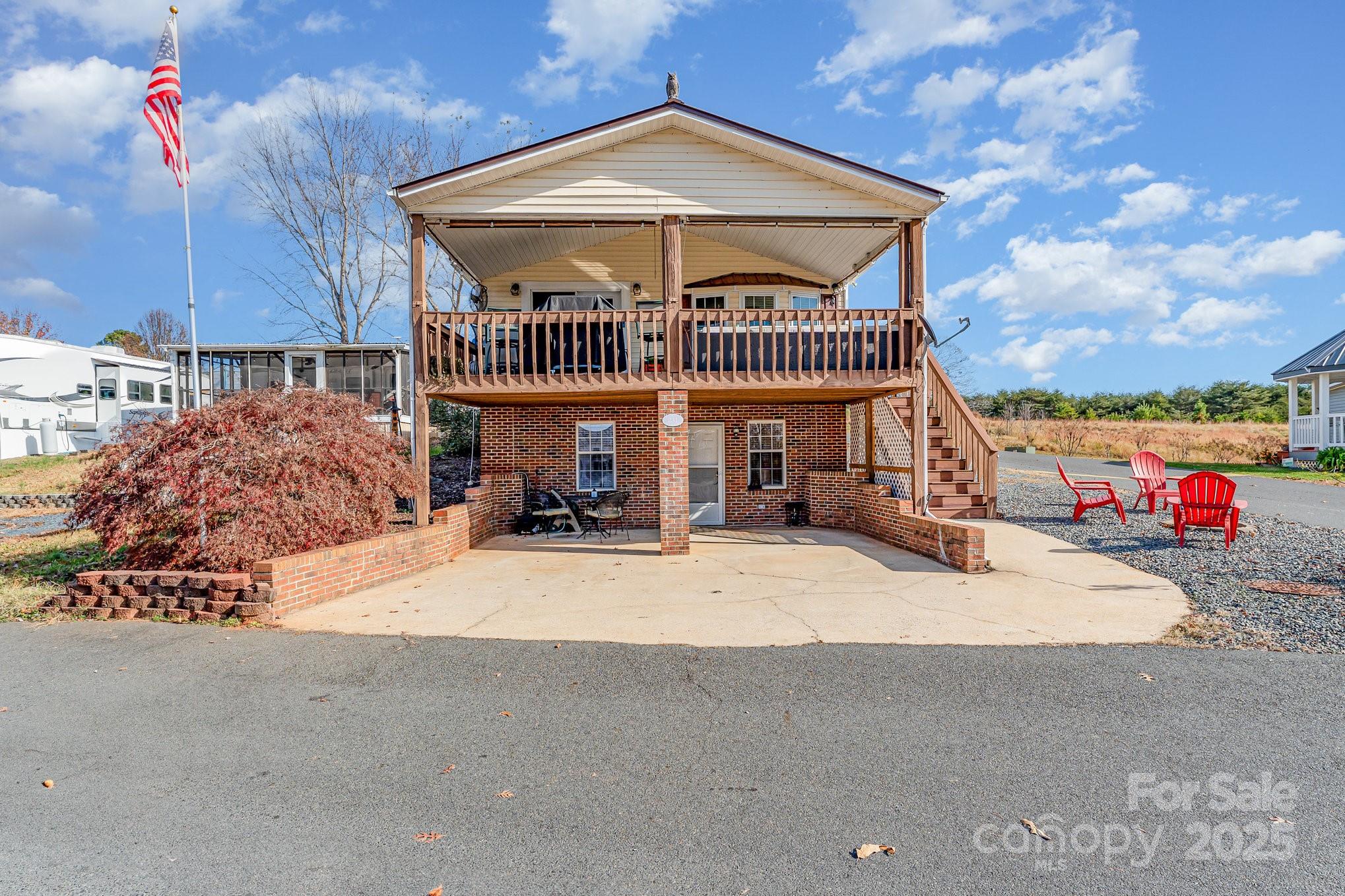 231 Badin Vw Road New London, NC 28127 - Photo 2 of 48 a view of a house with a yard and sitting area