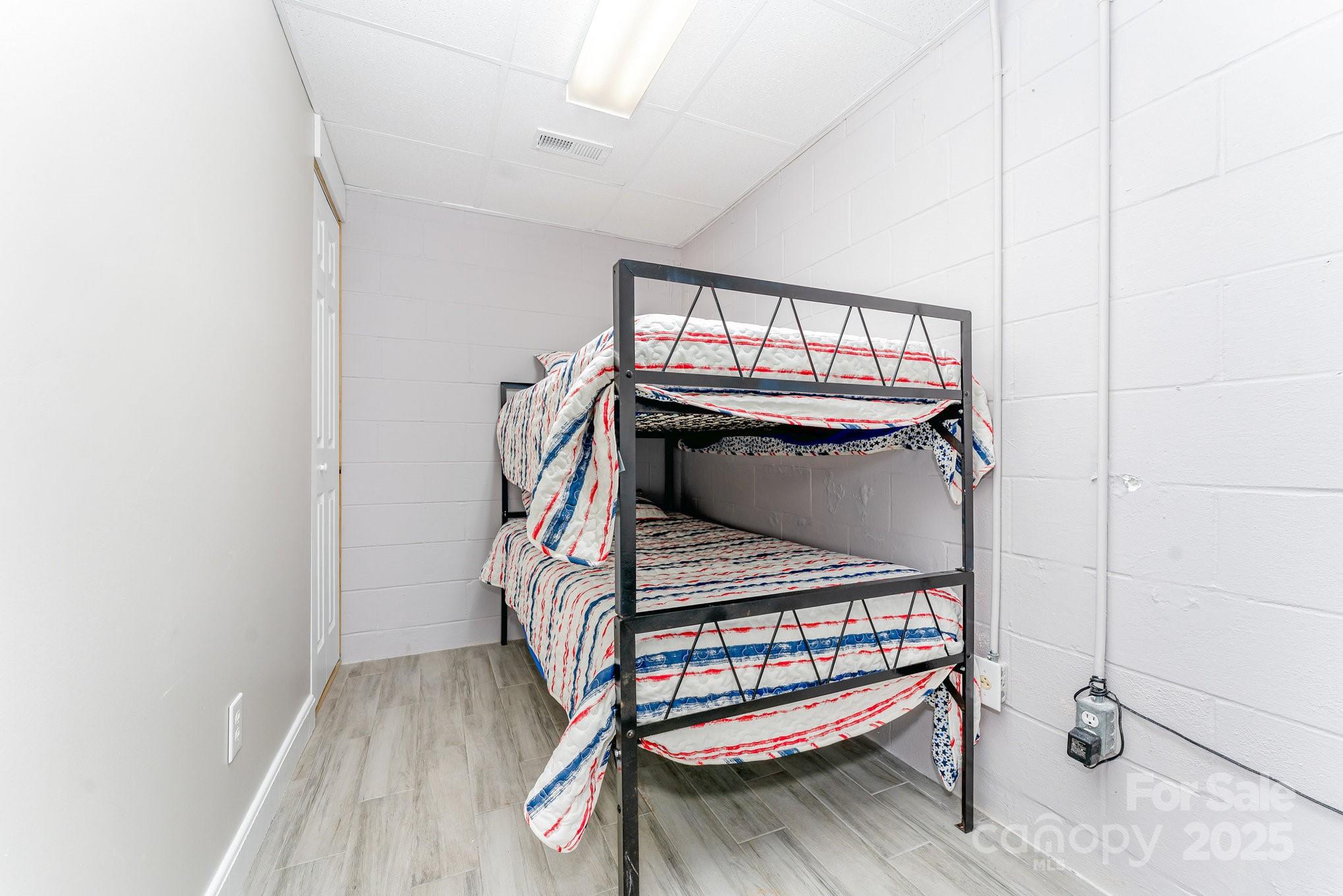 231 Badin Vw Road New London, NC 28127 - Photo 21 of 48 a bedroom with bunk bed