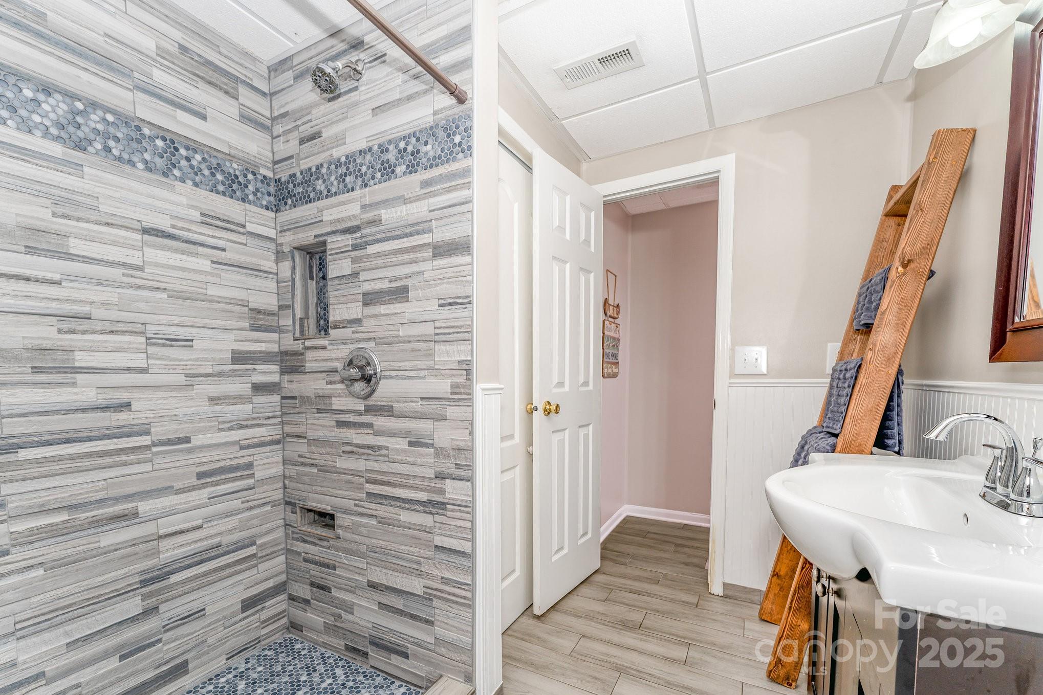 231 Badin Vw Road New London, NC 28127 - Photo 23 of 48 a bathroom with a sink and a mirror