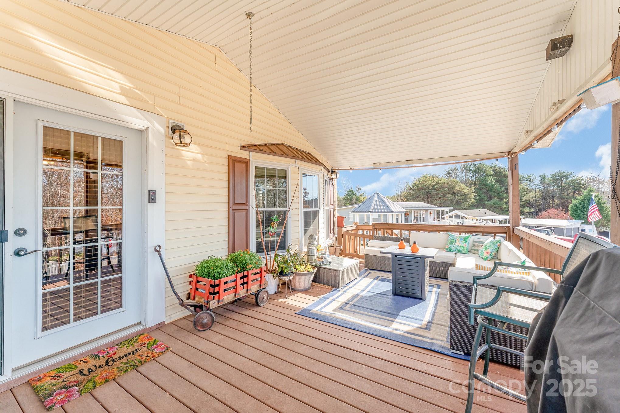 231 Badin Vw Road New London, NC 28127 - Photo 24 of 48 a balcony with furniture and a potted plant