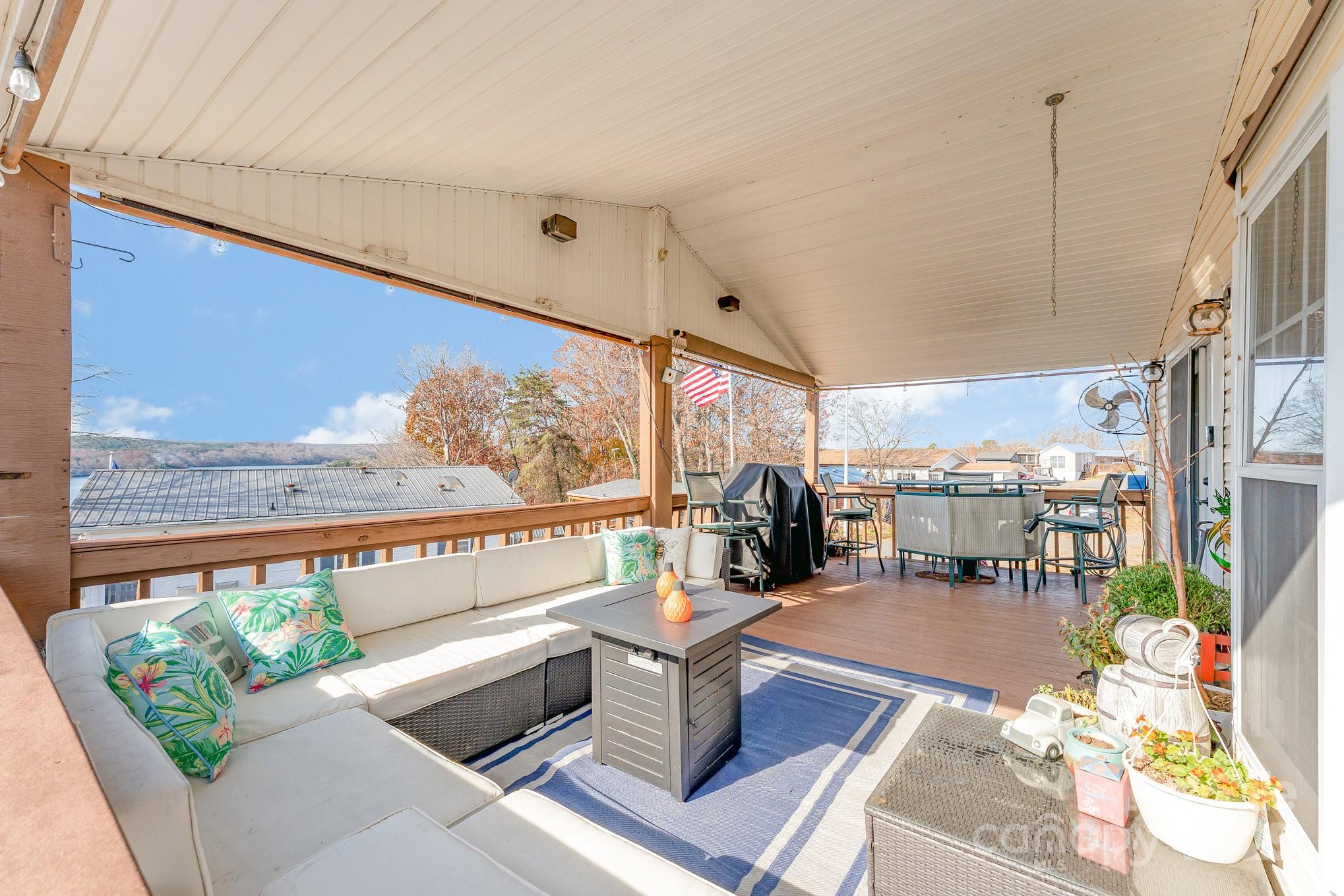 231 Badin Vw Road New London, NC 28127 - Photo 25 of 48 a living room with furniture a rug and a large window