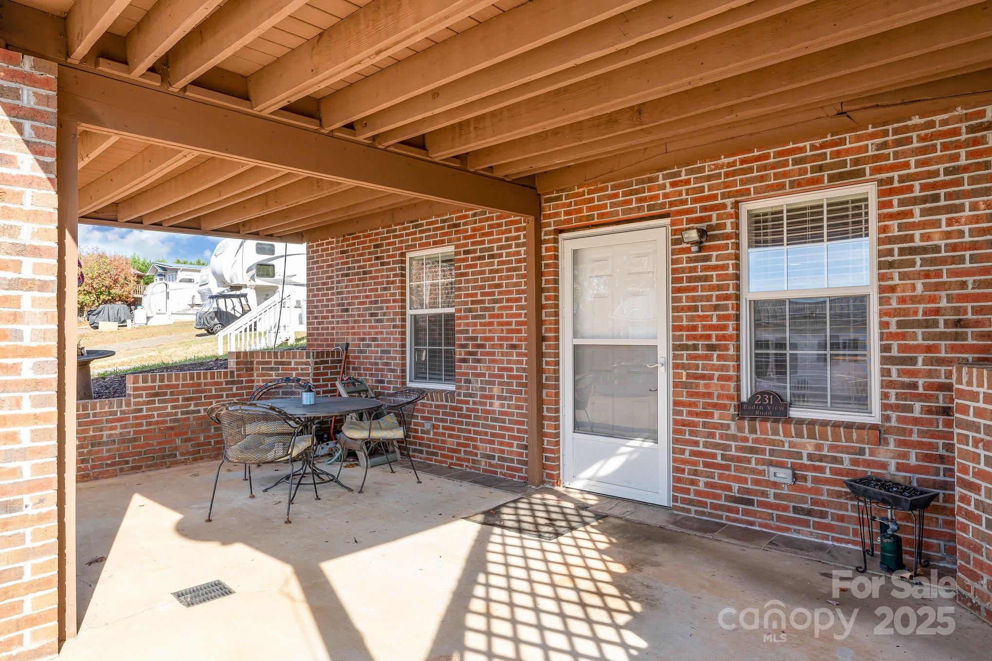231 Badin Vw Road New London, NC 28127 - Photo 29 of 48 a building outdoor space with patio furniture and potted plants
