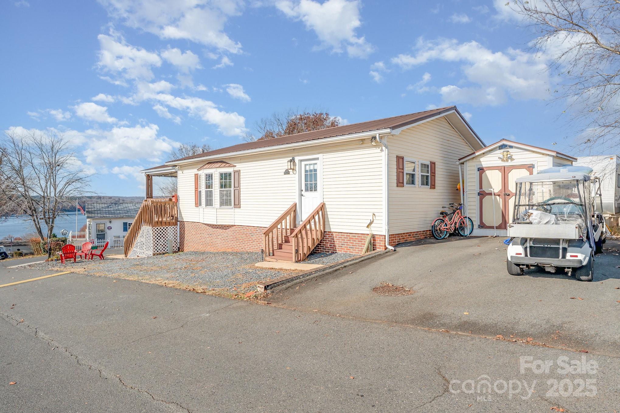 231 Badin Vw Road New London, NC 28127 - Photo 30 of 48 a view of a house with a patio