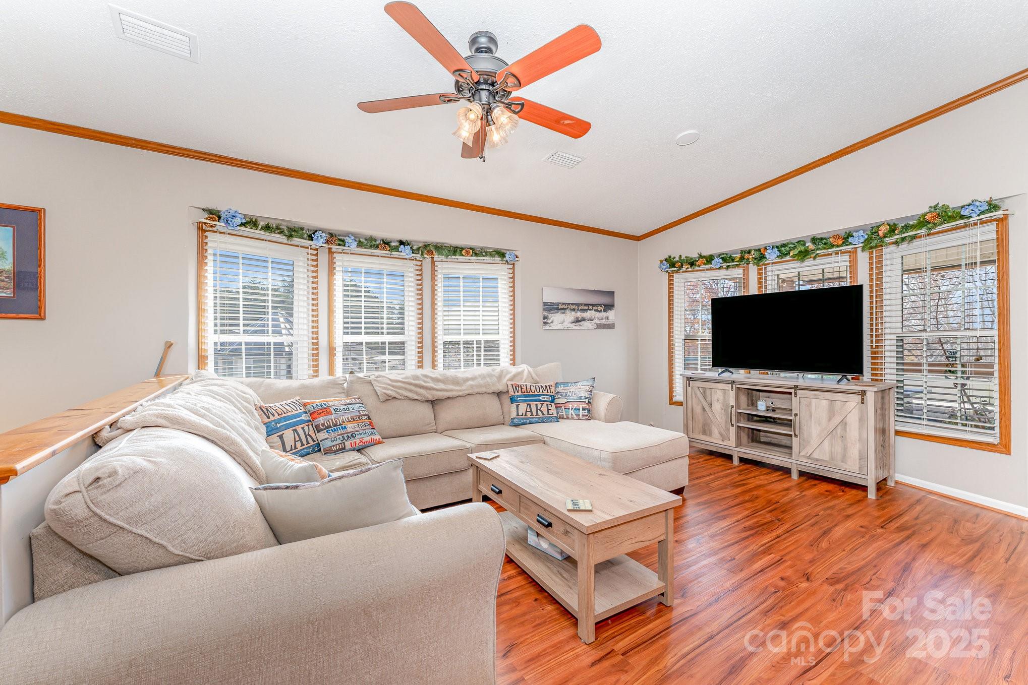 231 Badin Vw Road New London, NC 28127 - Photo 3 of 48 a living room with furniture and a flat screen tv