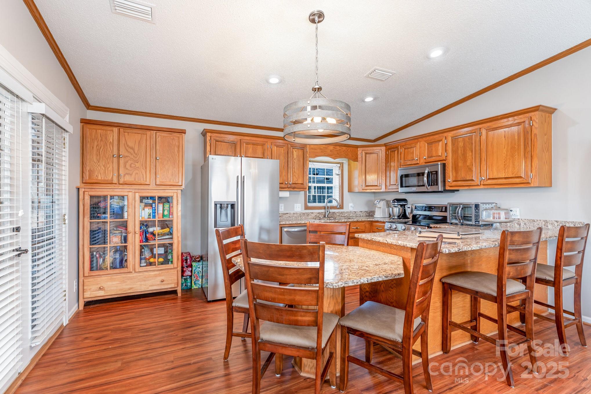 231 Badin Vw Road New London, NC 28127 - Photo 6 of 48 a view of a dining room with furniture window and wooden floor