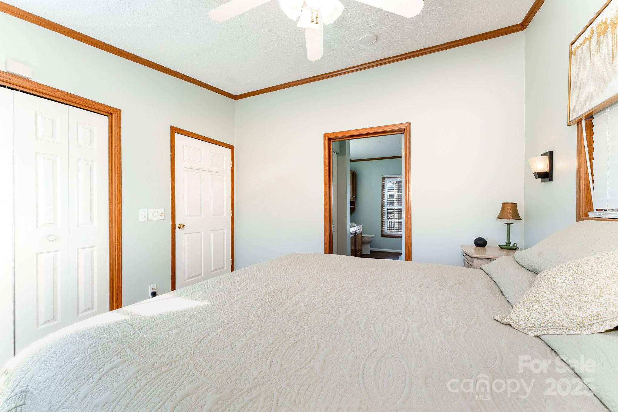 231 Badin Vw Road New London, NC 28127 - Photo 9 of 48 a large bed in a white room