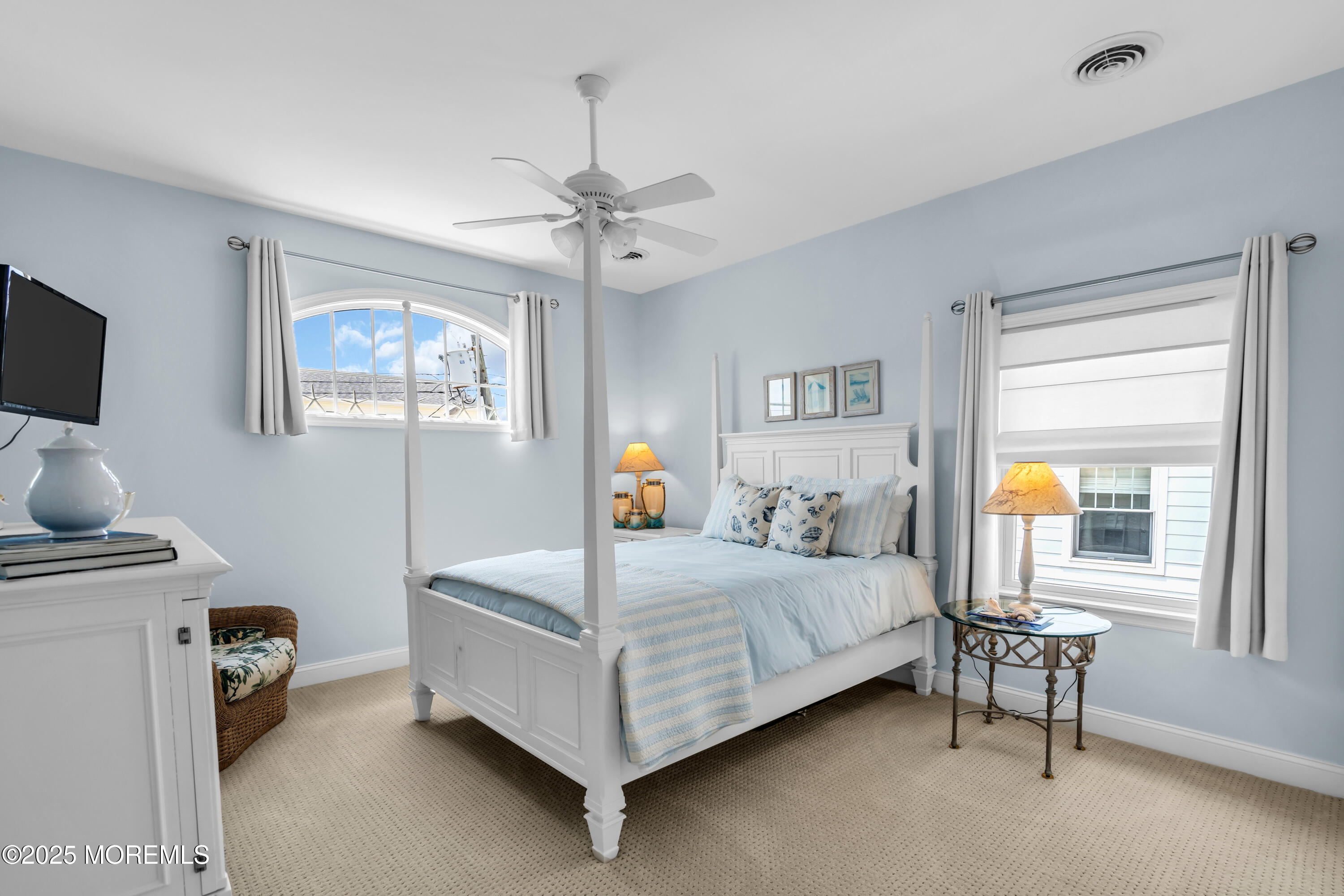 230 South Lagoon Road Lavallette, NJ 08735 - Photo 11 of 24 a bedroom with a bed and a chandelier