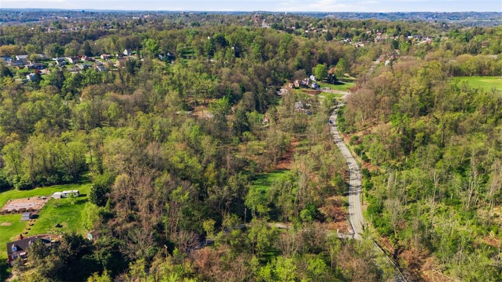 0 Hulton Road Verona, PA 15147 - Photo 8 of 17 an aerial view of residential houses with outdoor space and trees