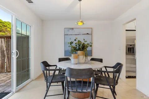 a view of a dining room with furniture window and outside view