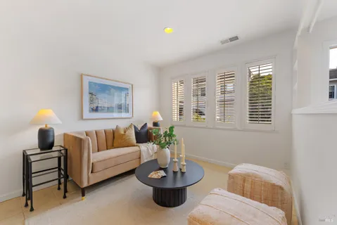 a kitchen with stainless steel appliances granite countertop a refrigerator a stove and a sink