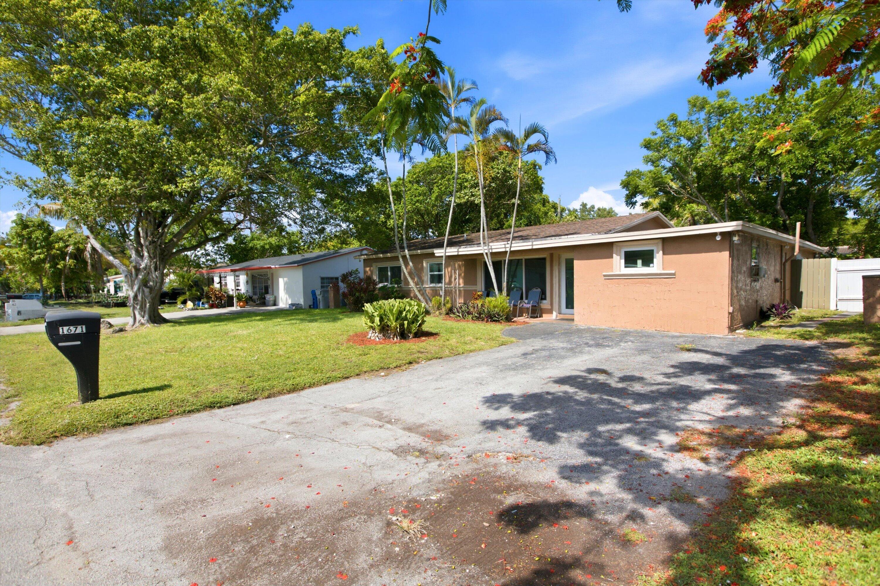 1671 North Cypress Road Pompano Beach, FL 33060 - Photo 5 of 34 01-Property Photo 001