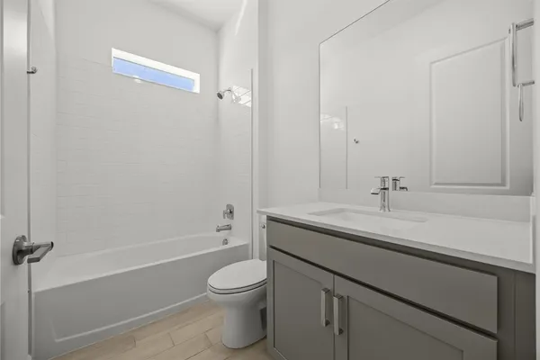 a view of a room with wooden floor