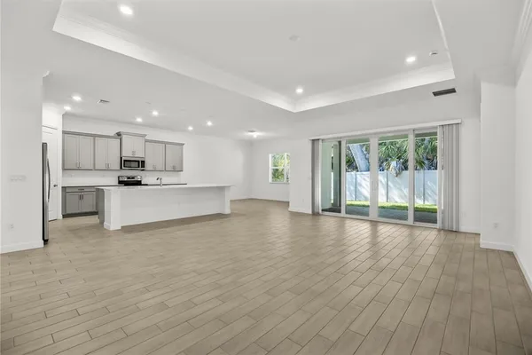 a view of kitchen with wooden floor and window