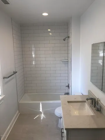 a bathroom with a sink and a bathtub