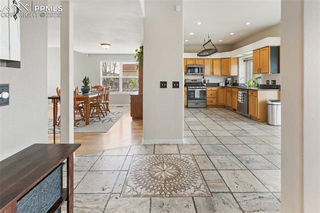 8291 Tibbs Road Peyton, CO 80831 - Photo 20 of 25 Kitchen with a detailed tiled floor-beautiful