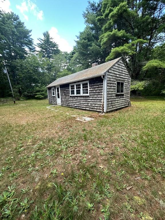 5 Fire Island Road Wareham, MA 02571 - Photo 1 of 7 a backyard of a house with lots of green space
