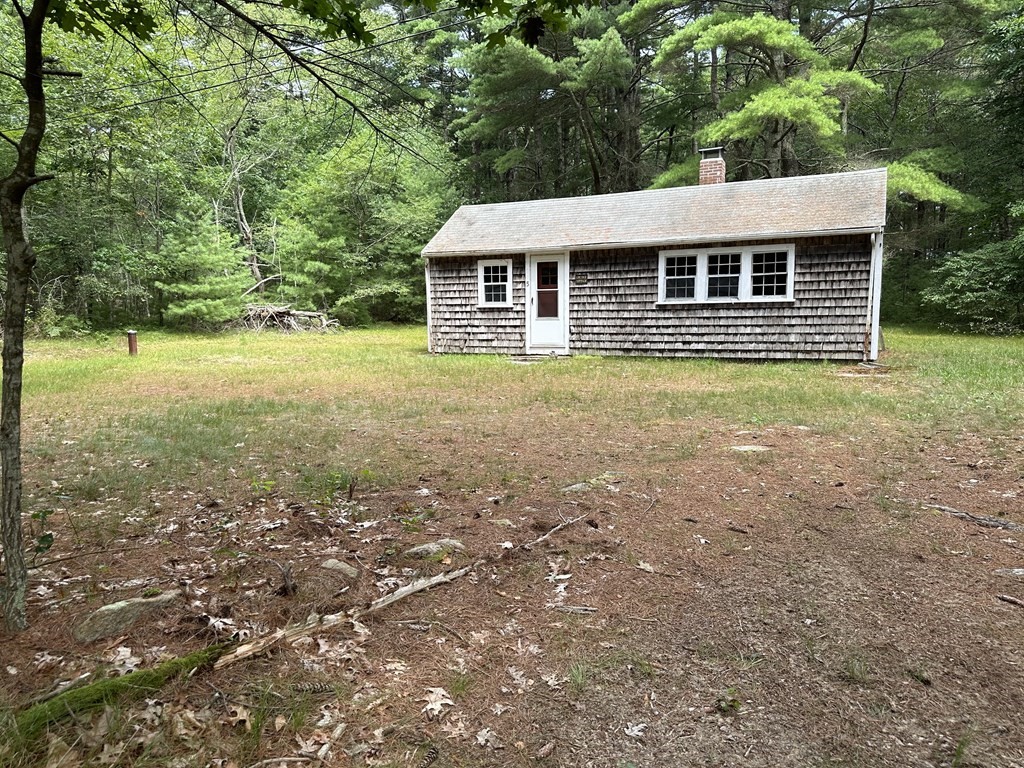 5 Fire Island Road Wareham, MA 02571 - Photo 3 of 7 a view of a house with backyard
