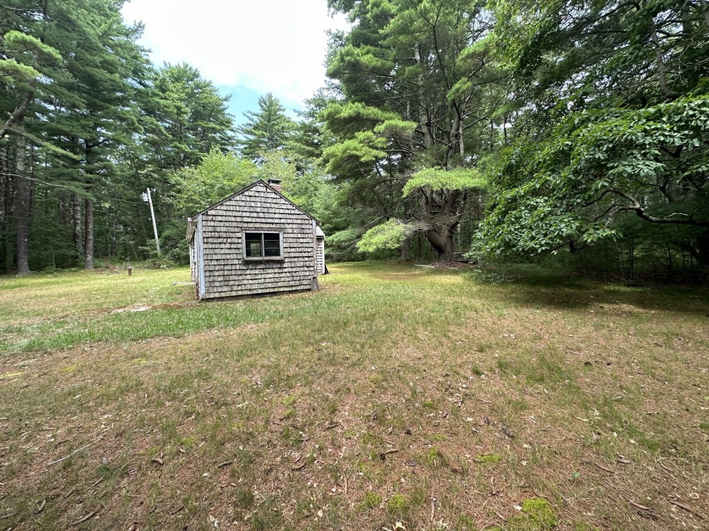 5 Fire Island Road Wareham, MA 02571 - Photo 7 of 7 a front view of a house with a yard