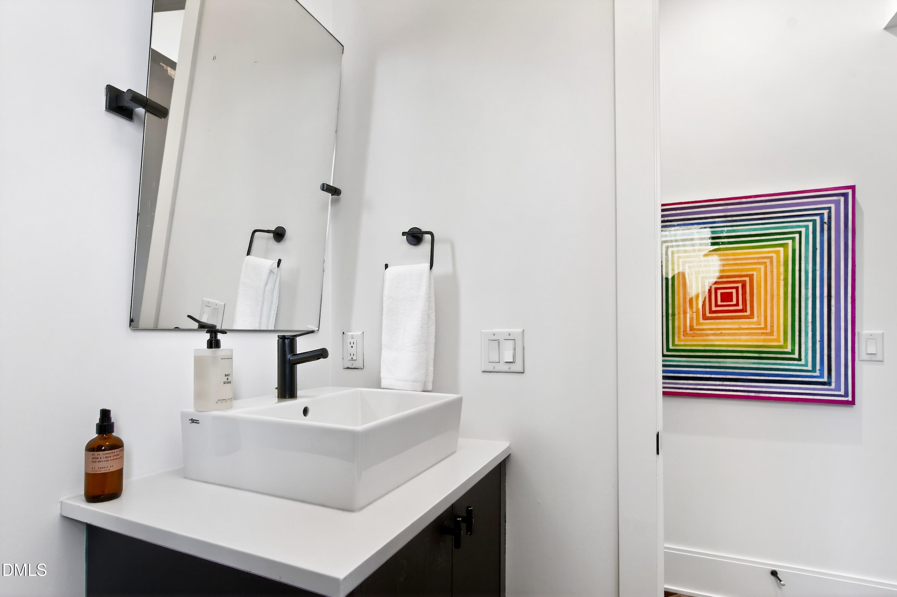 1617 Nottingham Road Raleigh, NC 27607 - Photo 32 of 76 a bathroom with a sink and a mirror