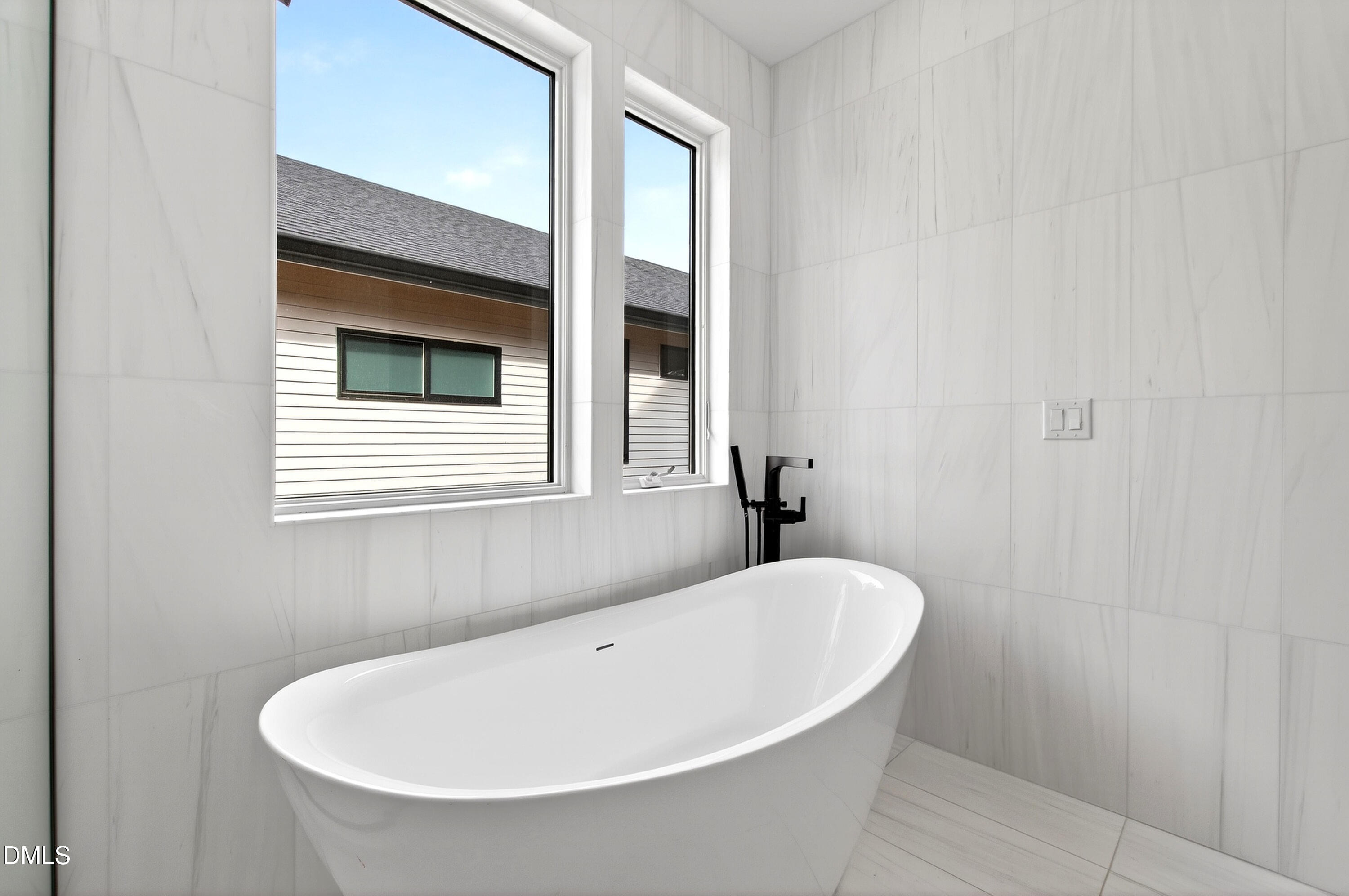 1617 Nottingham Road Raleigh, NC 27607 - Photo 42 of 76 a white bath tub sitting in a bathroom