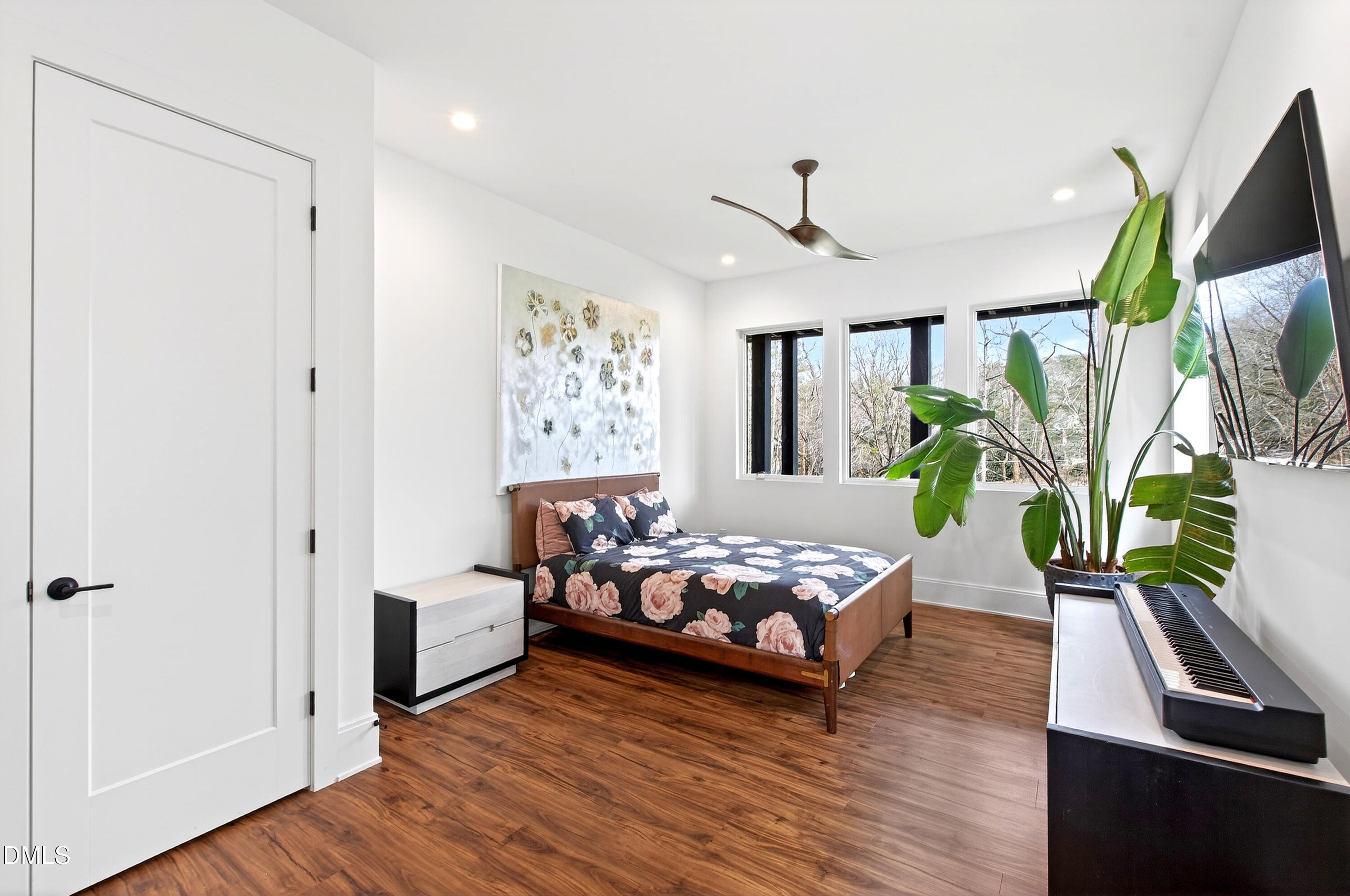 1617 Nottingham Road Raleigh, NC 27607 - Photo 49 of 76 a bedroom with furniture and a potted plant