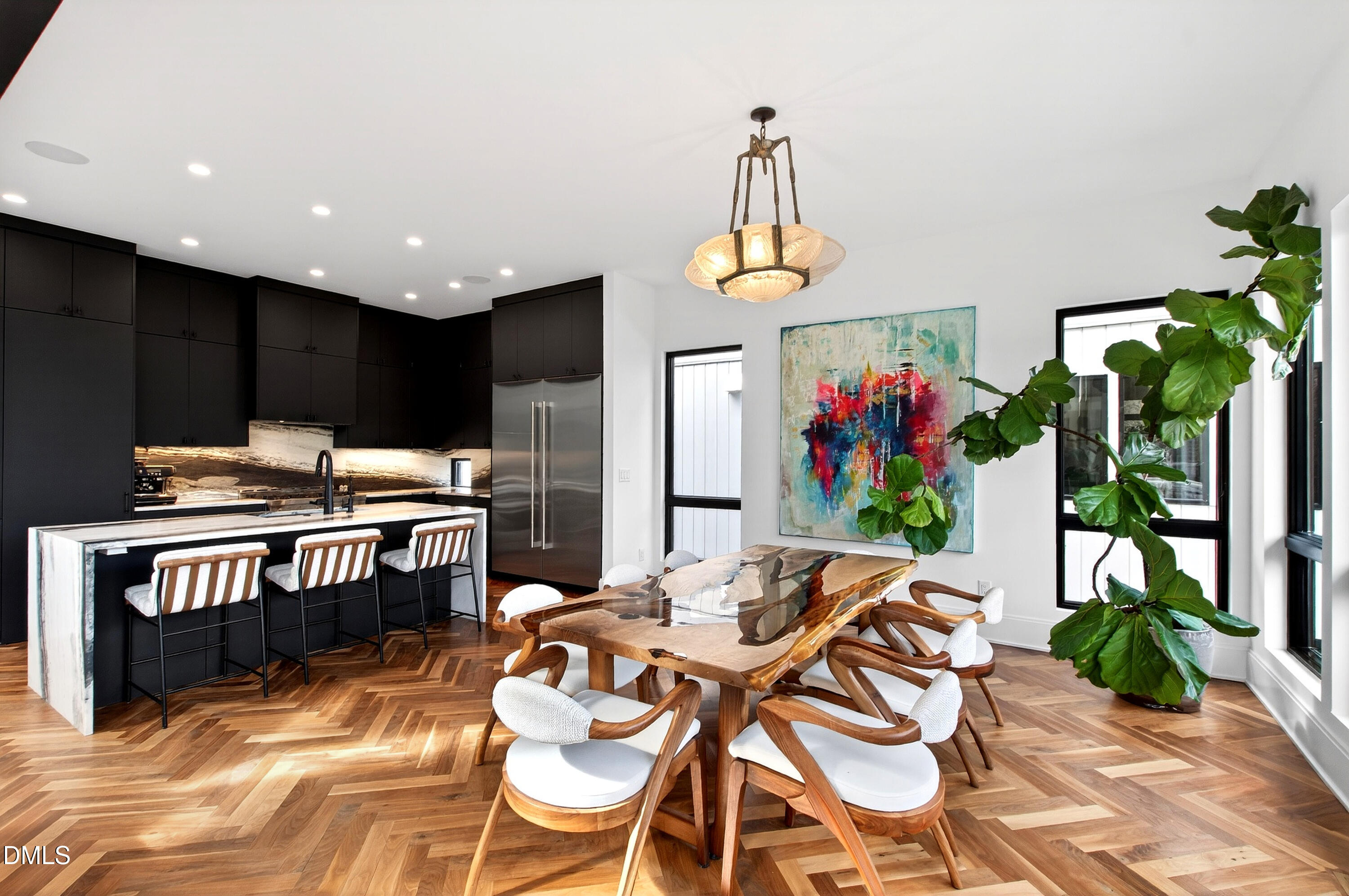1617 Nottingham Road Raleigh, NC 27607 - Photo 4 of 76 a view of a dining room with furniture a chandelier and wooden floor