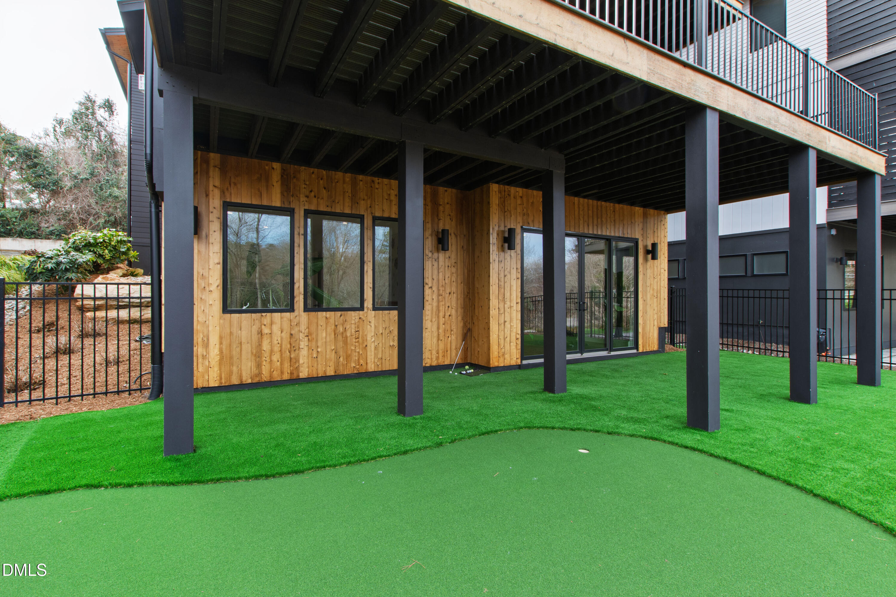 1617 Nottingham Road Raleigh, NC 27607 - Photo 59 of 76 a view of a backyard with wooden floor and fence