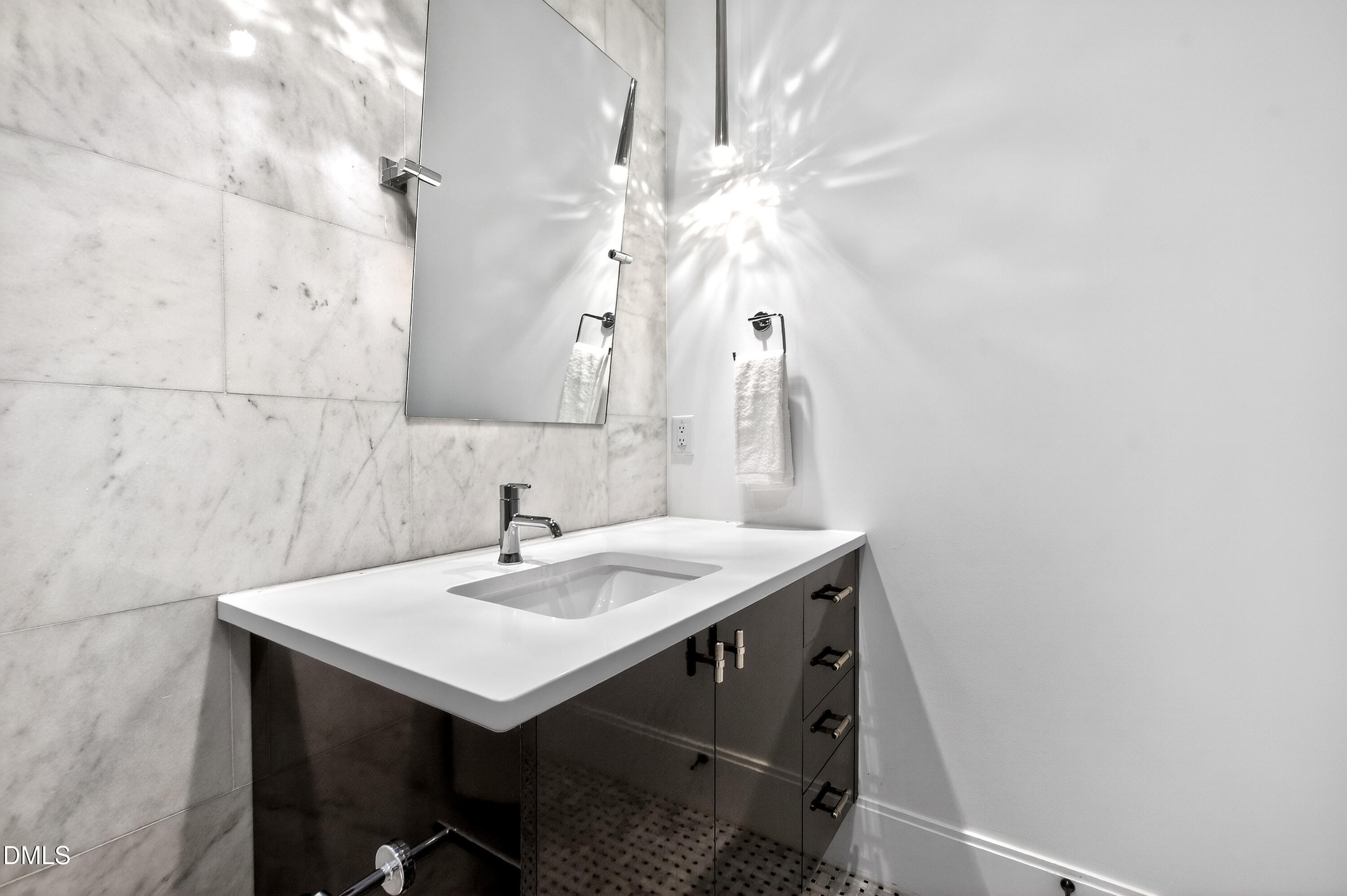 1617 Nottingham Road Raleigh, NC 27607 - Photo 60 of 76 a bathroom with a sink and a mirror