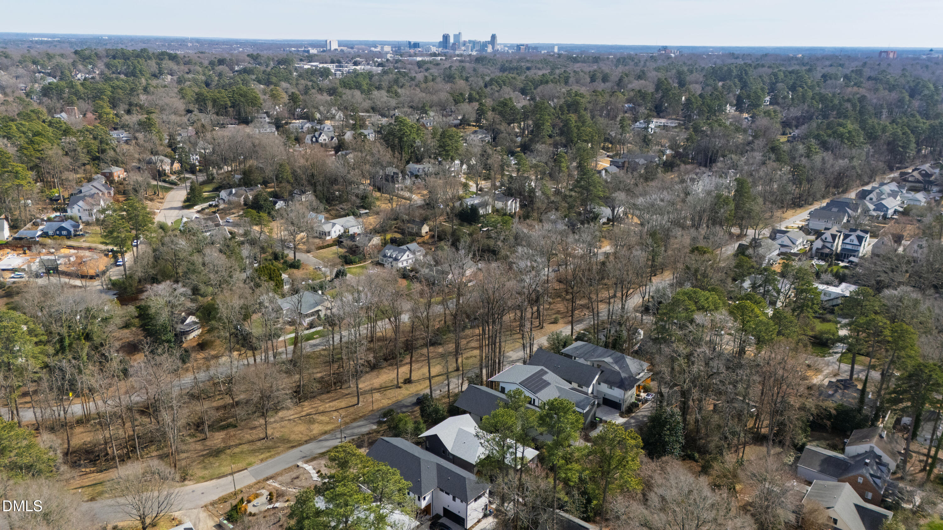 1617 Nottingham Road Raleigh, NC 27607 - Photo 71 of 76 a view of a city with lush green forest