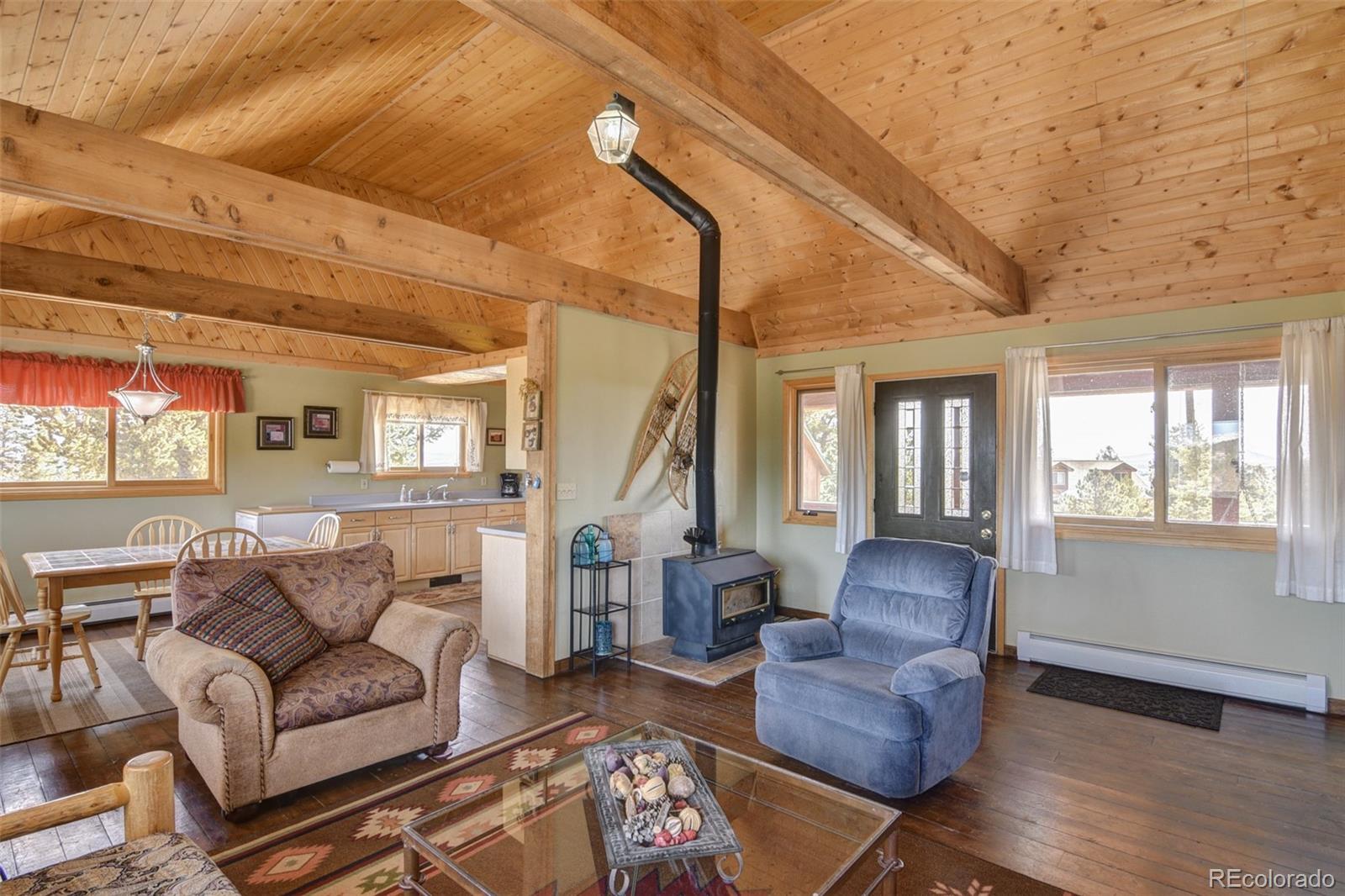3750 Singletree Road Hartsel, CO 80449 - Photo 15 of 46 a living room with furniture and wooden floor