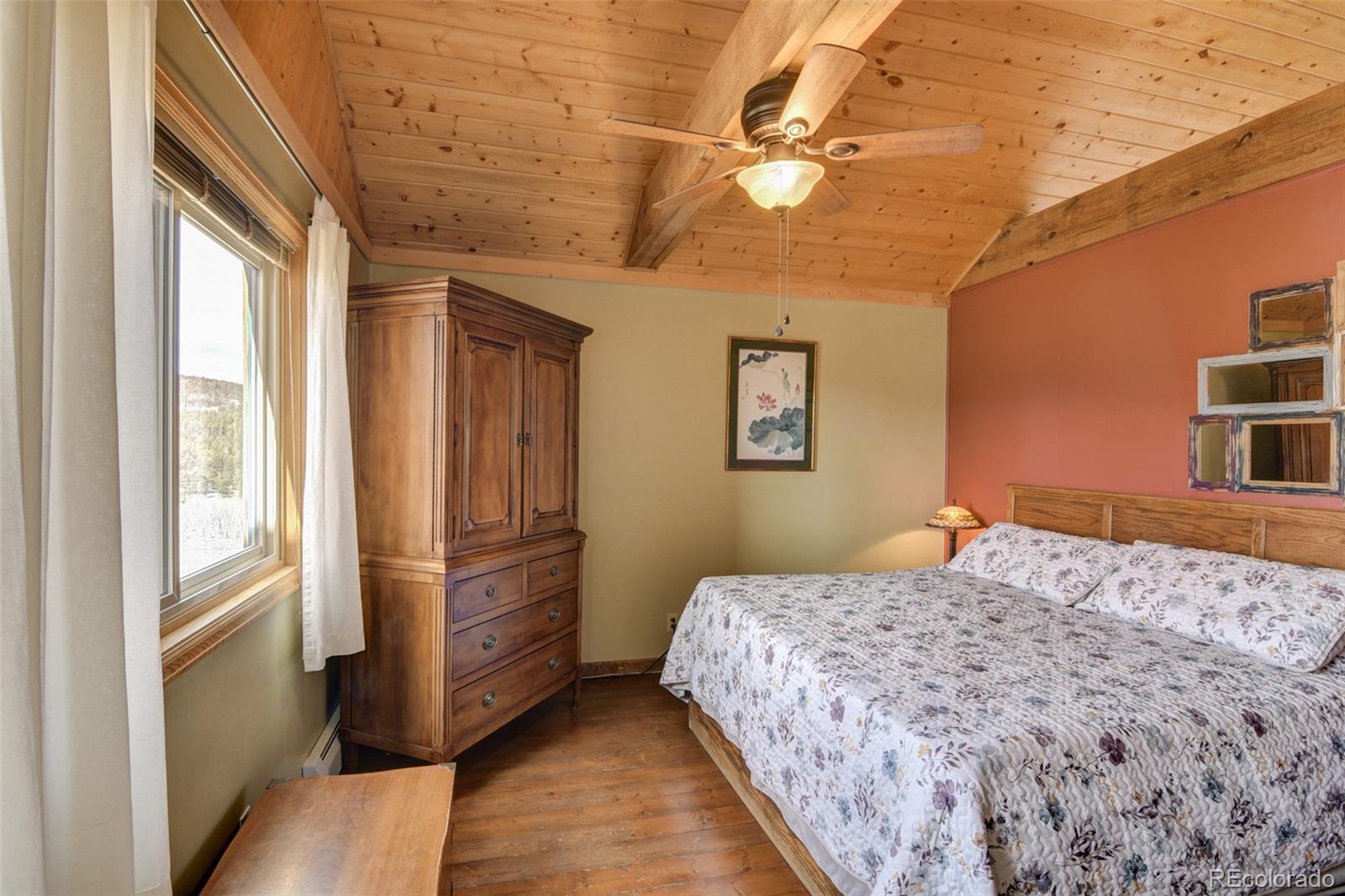 3750 Singletree Road Hartsel, CO 80449 - Photo 36 of 46 a bedroom with a bed and a dresser
