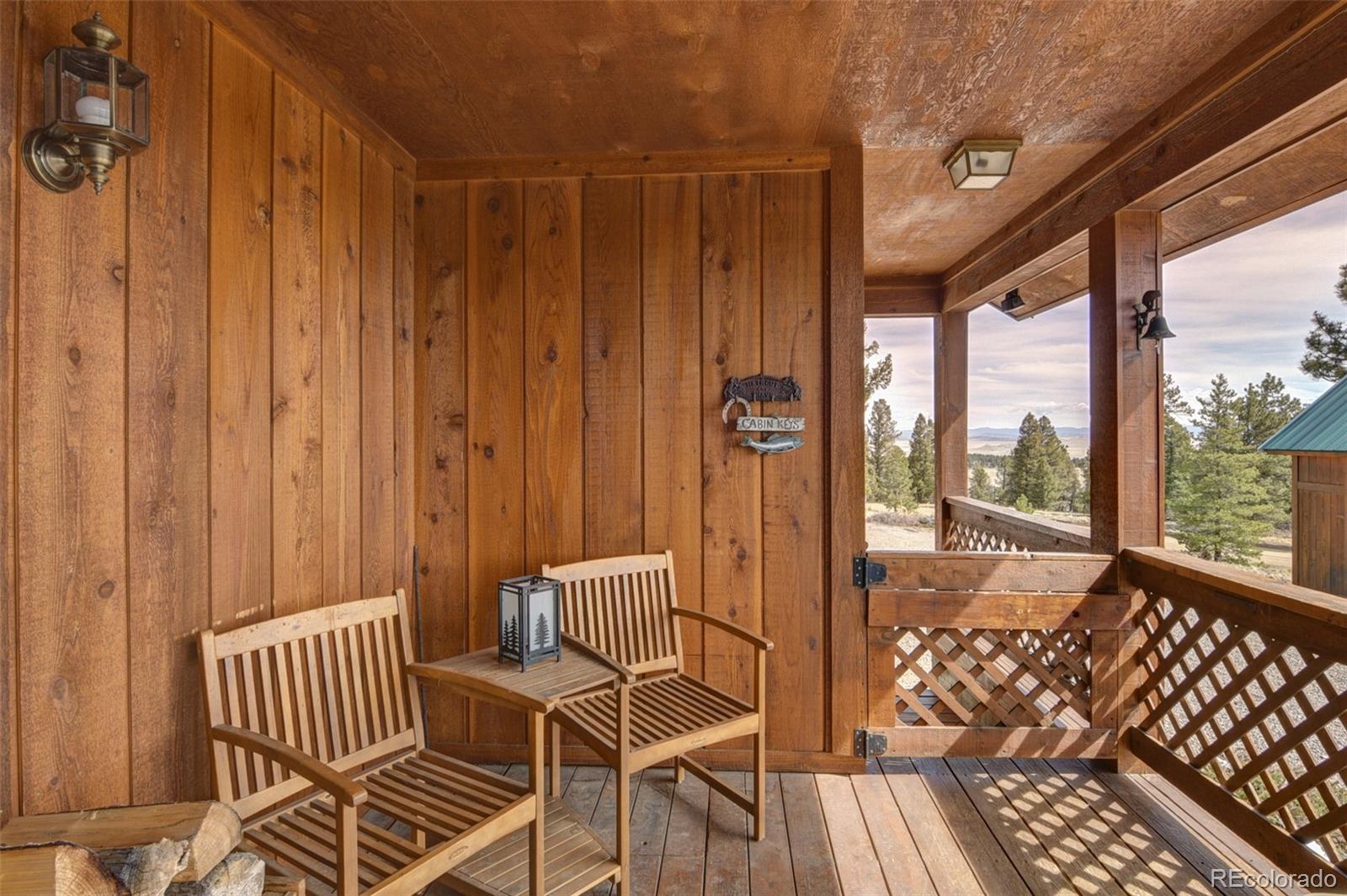 3750 Singletree Road Hartsel, CO 80449 - Photo 7 of 46 a view of a balcony with wooden floor