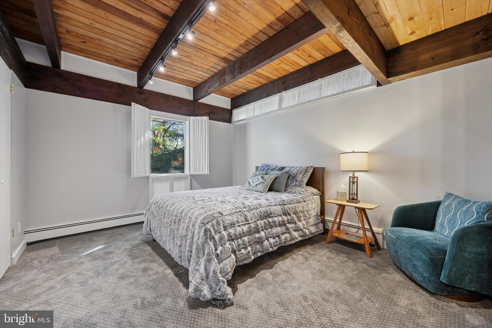 1430 Hopeland Road Wyncote, PA 19095 - Photo 26 of 37 a spacious bedroom with a bed and a couch