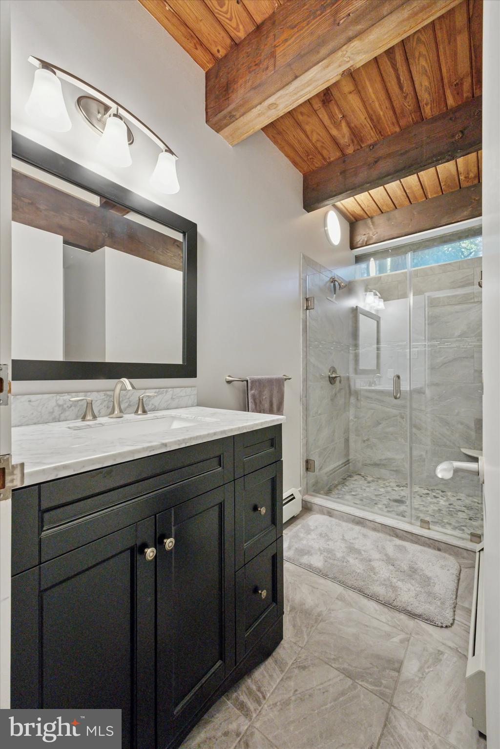 1430 Hopeland Road Wyncote, PA 19095 - Photo 30 of 37 a bathroom with a shower sink and mirror