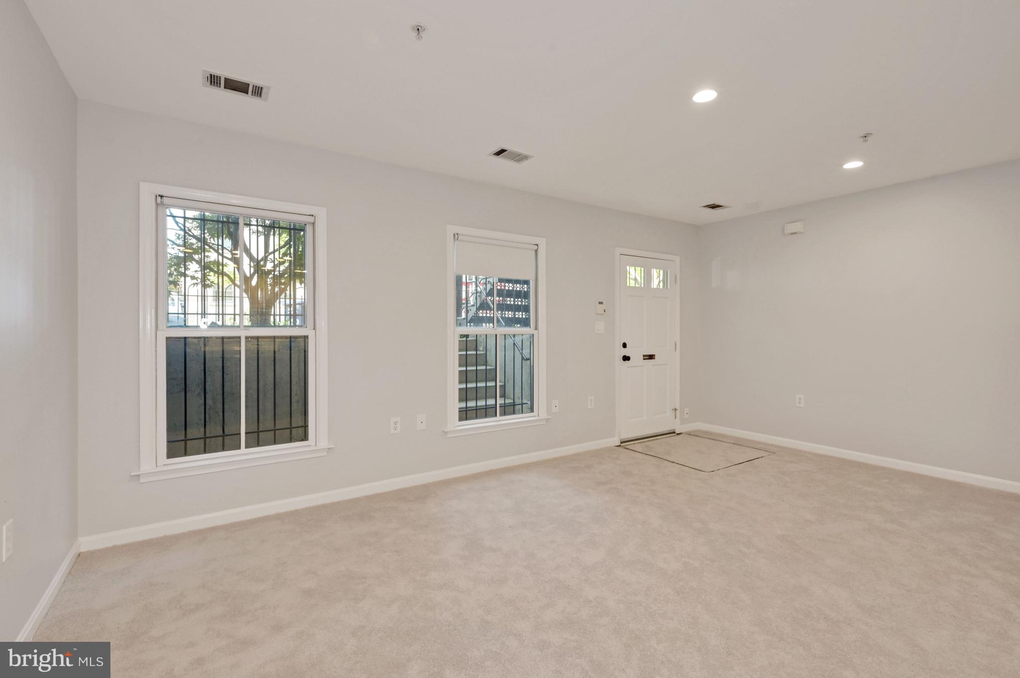 648 C Street Northeast, Unit 1 Washington, DC 20002 - Photo 11 of 17 an empty room with windows