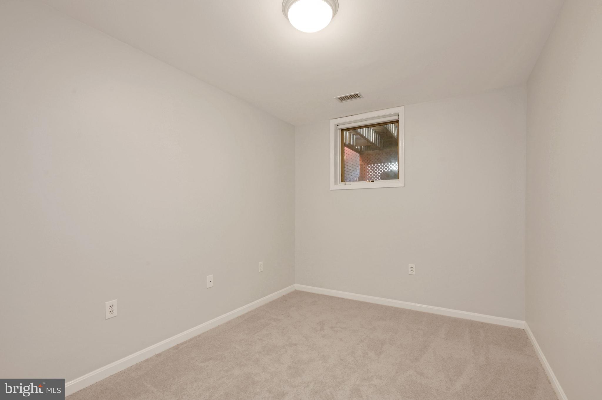 648 C Street Northeast, Unit 1 Washington, DC 20002 - Photo 13 of 17 an empty room with a window