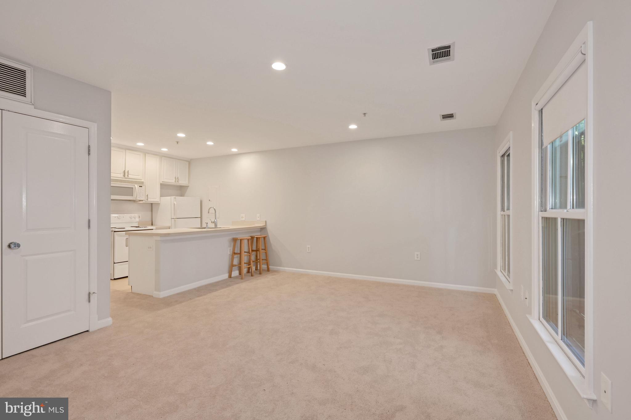 648 C Street Northeast, Unit 1 Washington, DC 20002 - Photo 5 of 17 a view of a kitchen with a refrigerator and a sink