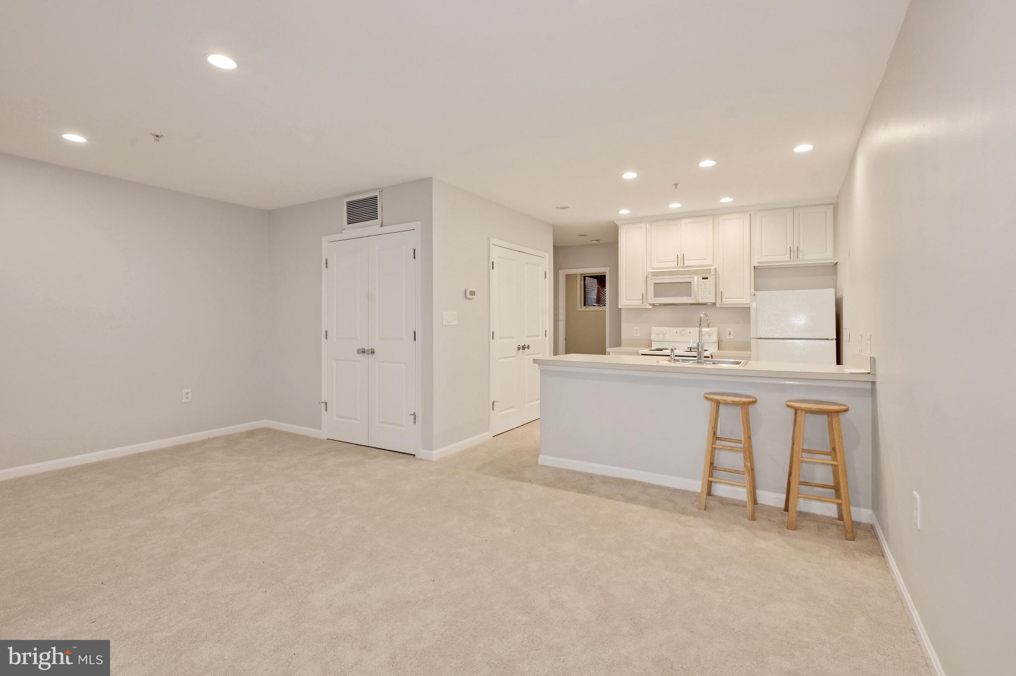 648 C Street Northeast, Unit 1 Washington, DC 20002 - Photo 6 of 17 a view of kitchen with center island stainless steel appliances cabinets and a sink