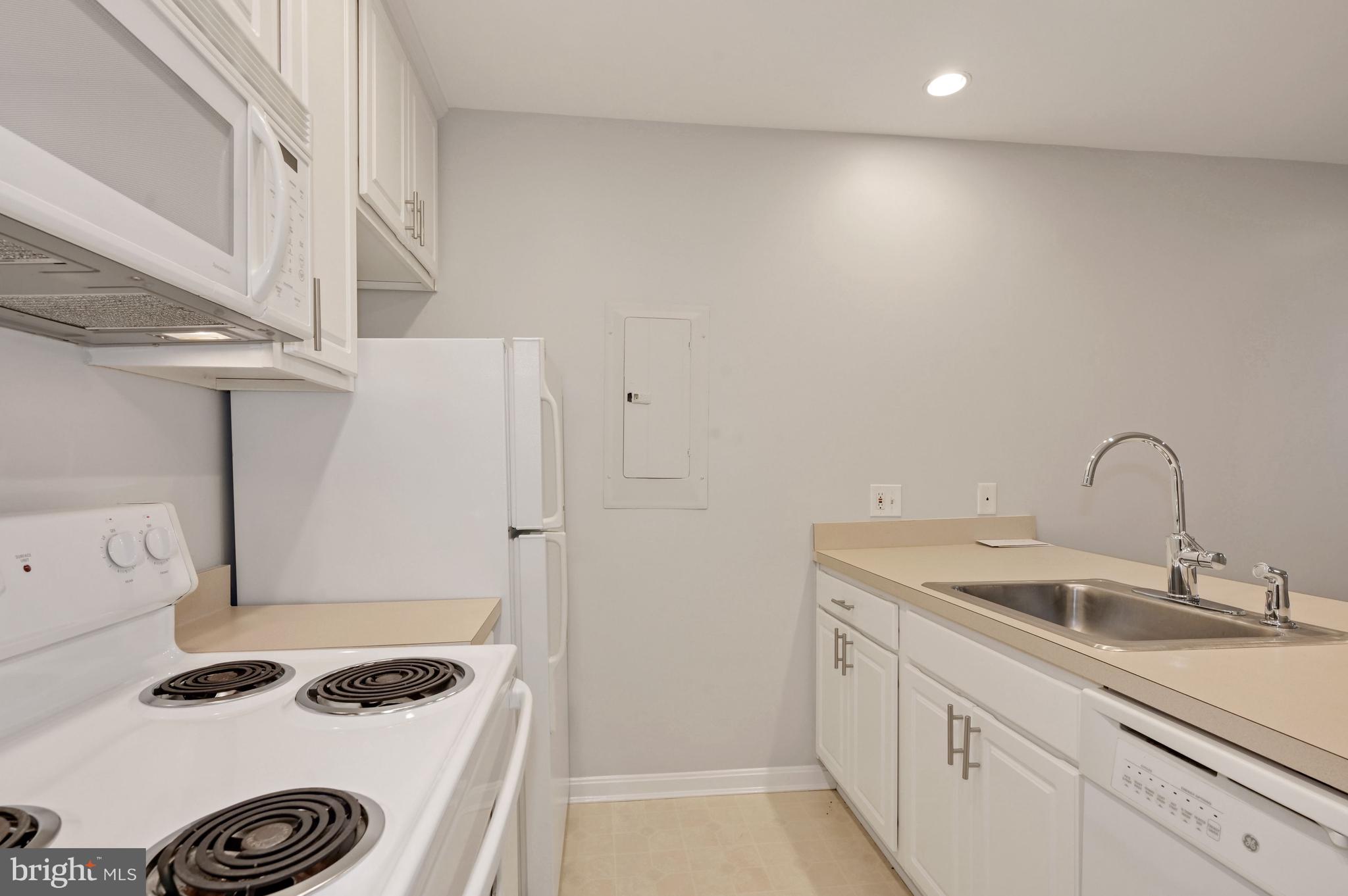 648 C Street Northeast, Unit 1 Washington, DC 20002 - Photo 9 of 17 a kitchen with sink a stove and refrigerator