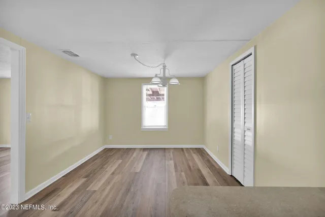 a view of livingroom with hardwood floor and window